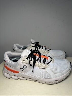 On Running Black and White Athletic Shoes with Orange Accent